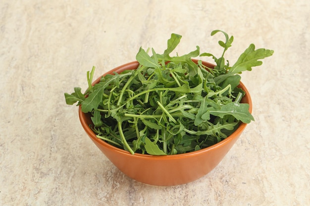 Fresh green arugula in the bowl