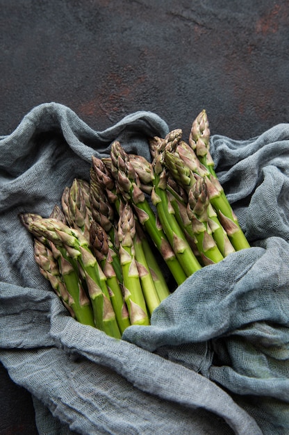 Fresh green asparagus  on black concrete. Flat lay