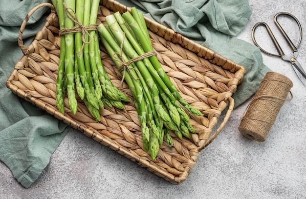 Fresh green asparagus on concrete background