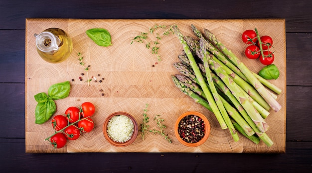 Fresh green asparagus on a rustic wooden table with. Top view