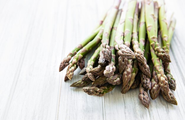 Fresh green asparagus  on  wooden table. Flat lay