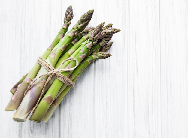 Fresh green asparagus  on  wooden table. Flat lay