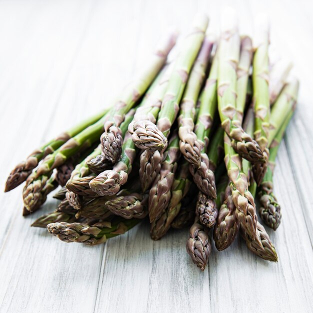 Fresh green asparagus  on  wooden table. Flat lay