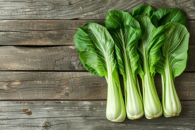 Fresh green bok choy or pac choi chinese cabbage on a brown wooden background