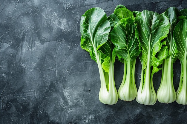 Fresh green bok choy or pac choi chinese cabbage on a brown wooden background