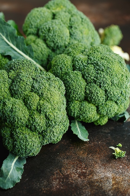 Fresh green broccoli on a dark brown table