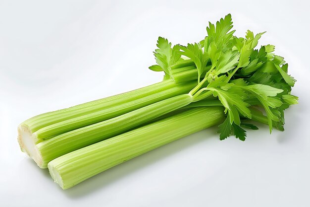 Photo fresh green celery stalks with leaves on white background