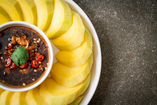 fresh green and golden mango with sweet fish sauce dipping, Asian style