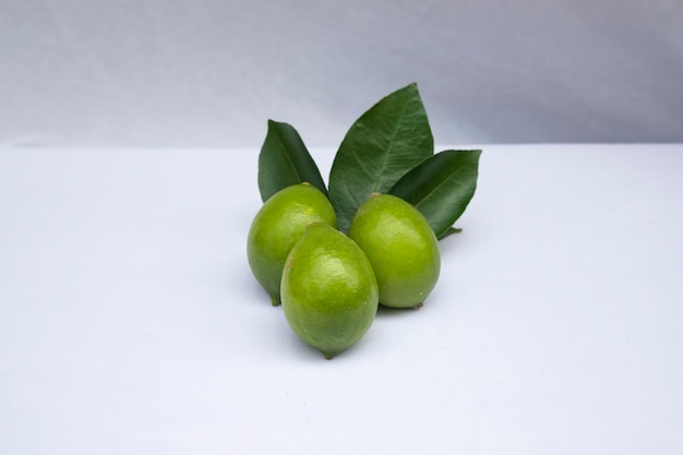 Fresh green lemon with leaf