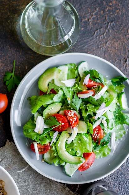 Fresh green organic salad with raw ingredients