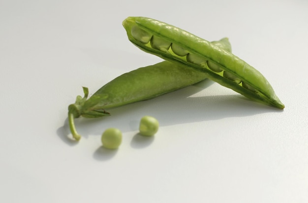 Fresh green peas in a pod and with peas