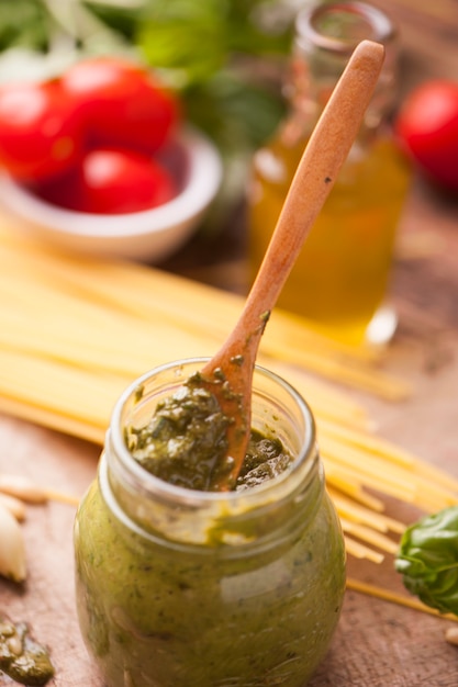 Fresh green pesto in a preserving glass