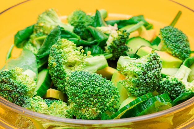 Fresh green salad of avocado broccoli spinach and cucumber for body detoxification