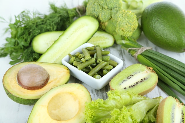 Fresh green vegetables, on wooden