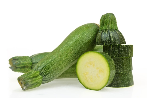 Fresh green zucchinis isolated on white background