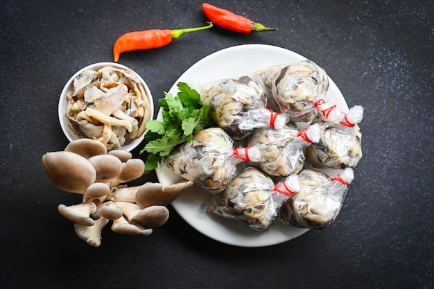 Fresh grey oyster mushroom on plate cooked oyster mushroom for cooking food processed food street mushroom package