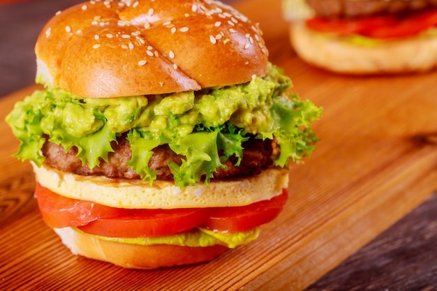 Fresh Hamburger tasty grilled beef burger on wood background