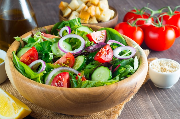 Fresh healthy salad with delicious spinach, feta cheese, red onion, cucumber and cherry tomato