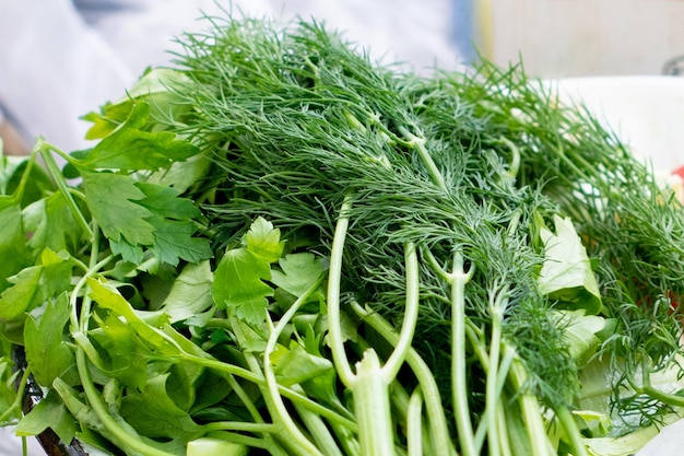 Fresh herbs dill and parsley on a table