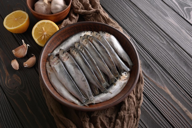 Fresh herring on rustic wooden background close up shot