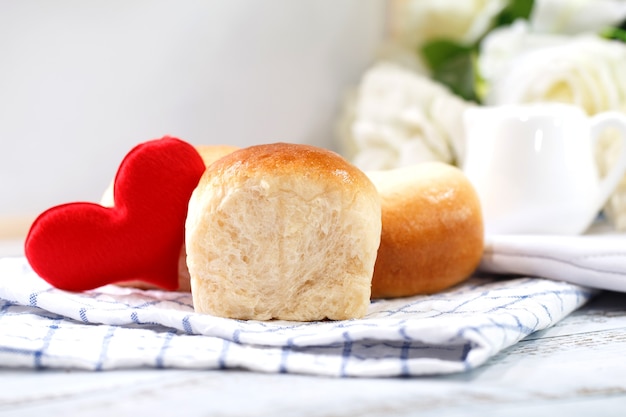 Fresh home made bread on white table with napkin