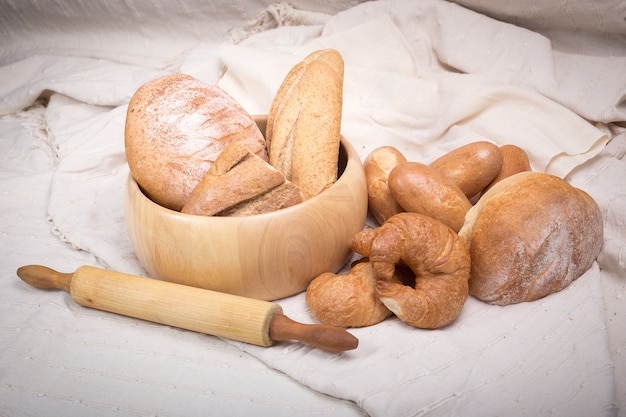 Fresh homemade bread in a cotton cloth background