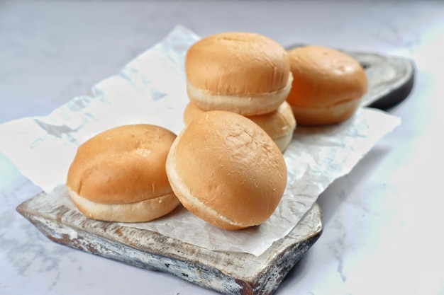 fresh homemade burger buns on white background