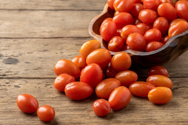 Fresh homemade cherry tomatoes on a wooden table