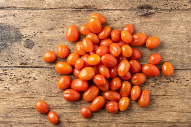 Fresh homemade cherry tomatoes on a wooden table