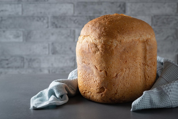 Fresh homemade crisp bread on a gray table