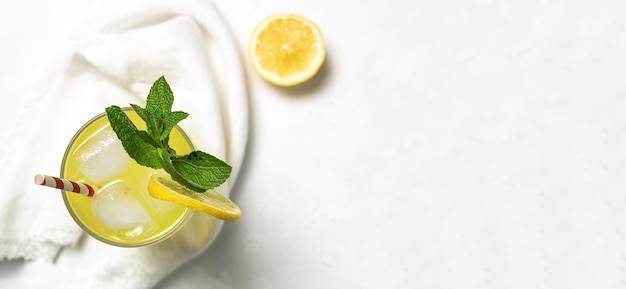 Fresh Homemade Lemonade or mojito cocktail with lemon mint and ice