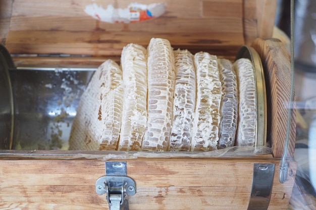 Fresh honey with comp in in wooden box