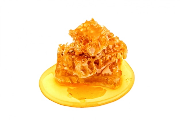 Fresh honeycomb with honey on white.