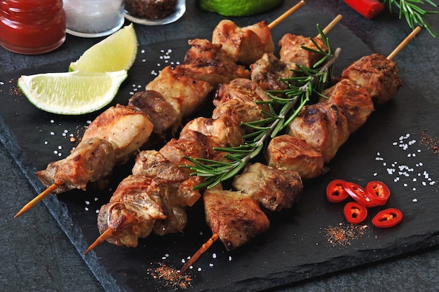 Fresh hot kebab with rosemary, lime and chili