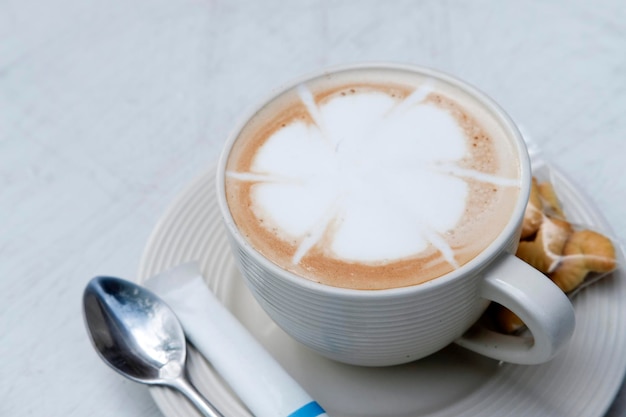 Fresh hot latte coffee serve on table