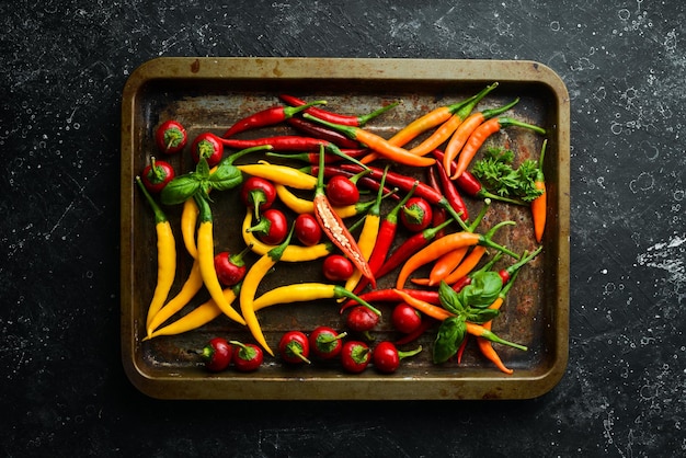 Fresh hot pepper on a metal tray Food background Top view