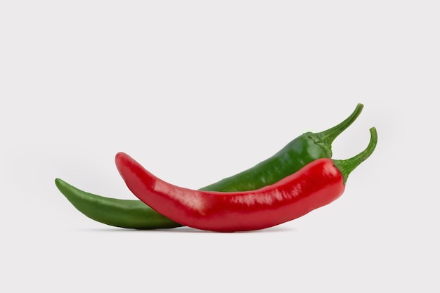 Fresh hot red and green peppers on a white isolated background