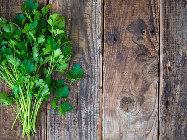 Fresh italian parsley on a wooden table parsley