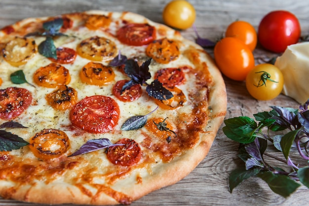 Fresh Italian pizza with tomatoes and mozzarella