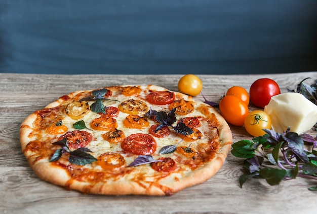 Fresh Italian pizza with tomatoes and mozzarella