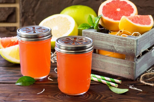 Fresh juice from a juicy grapefruit on a wooden table