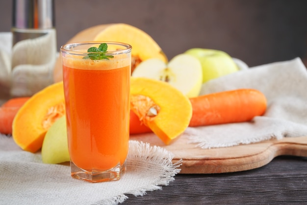 Fresh juice, mix fruits and vegetable on a wooden table