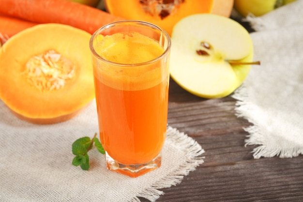 Fresh juice, mix fruits and vegetable on a wooden table