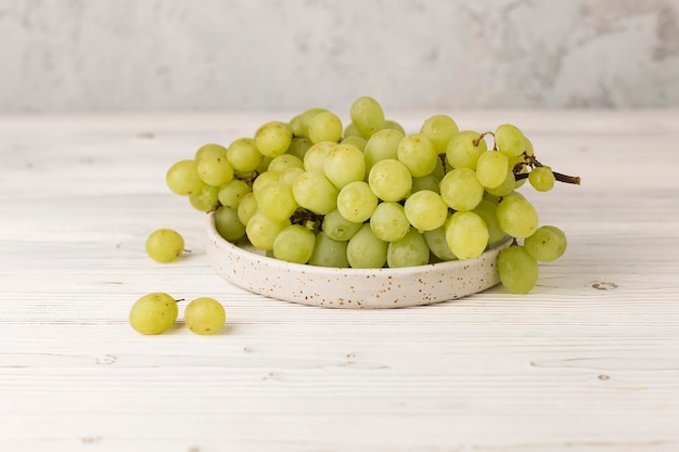 fresh juicy black and green grape on table