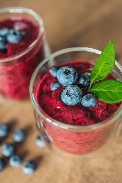 Fresh juicy blueberry smoothies in the glass Simple background Healthy food Detox Lifestyle