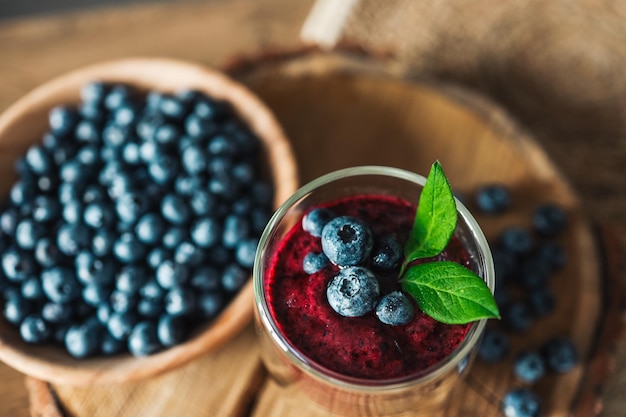 Fresh juicy blueberry smoothies in the glass Simple background Healthy food Detox Lifestyle