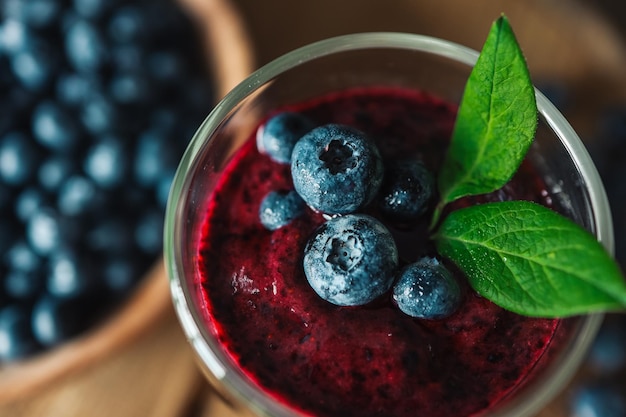 Fresh juicy blueberry smoothies in the glass Simple background Healthy food Detox Lifestyle