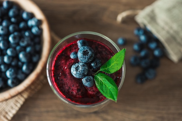 Fresh juicy blueberry smoothies in the glass Simple background Healthy food Detox Lifestyle