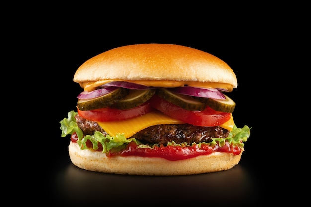 Fresh juicy burger on black background