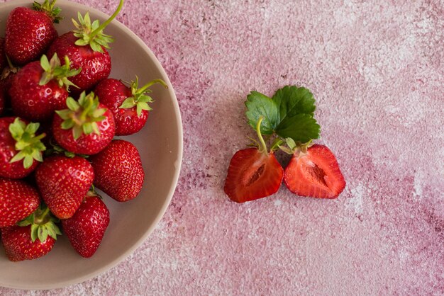 Fresh juicy strawberry on a concrete